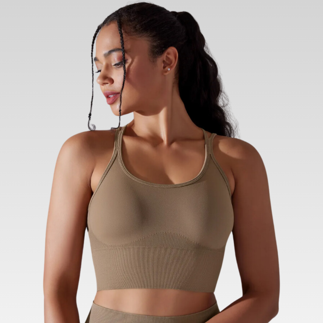 Georgia Cross Back Sports Bra: Medium support for versatile workouts. Crafted from a nylon/spandex blend for flexibility and style. Breathable design for cool workouts and quick-dry technology for on-the-go convenience. Elevate your workout confidence with the Georgia Sports Bra.