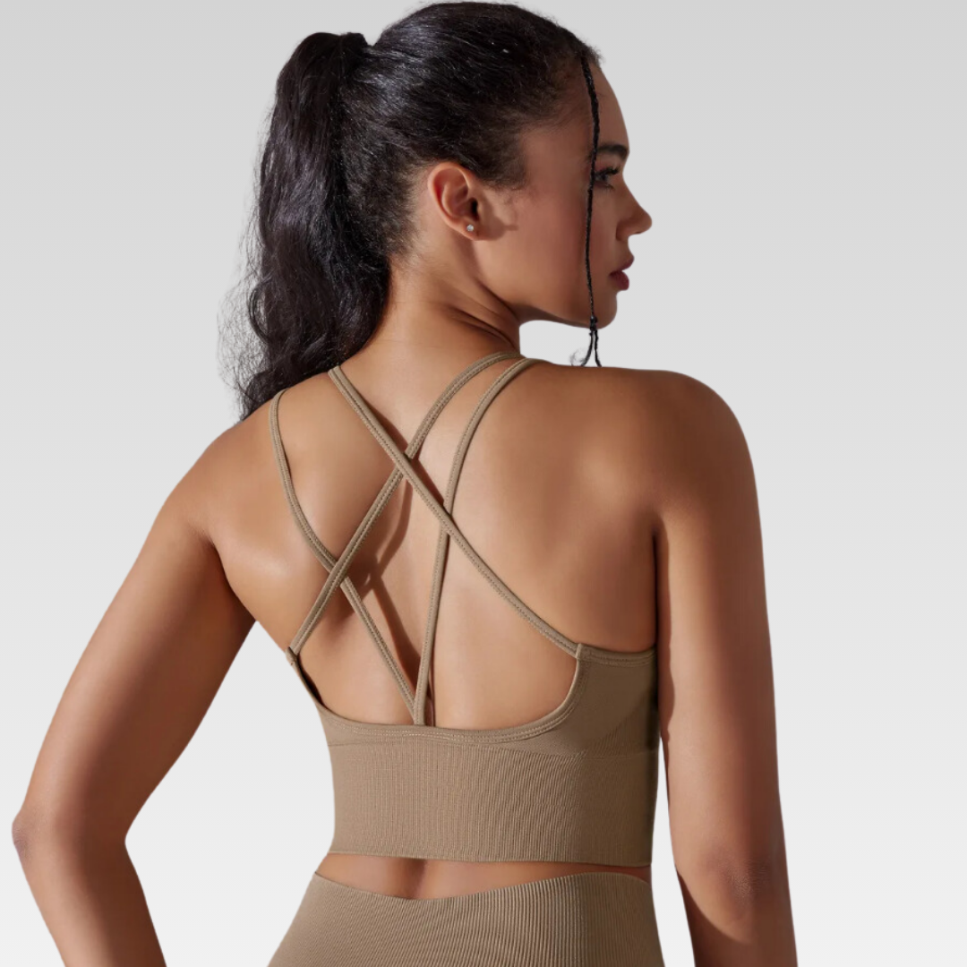 Georgia Cross Back Sports Bra: Medium support for versatile workouts. Crafted from a nylon/spandex blend for flexibility and style. Breathable design for cool workouts and quick-dry technology for on-the-go convenience. Elevate your workout confidence with the Georgia Sports Bra.