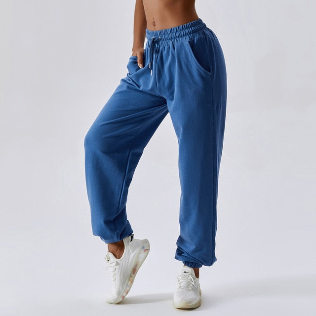 Cali Loose Fit Sweats: Crafted from a durable cotton/spandex blend for the perfect balance of comfort, style, and functionality. Built to last with a premium blend designed to withstand any activity. Stay comfortable with moisture-wicking fabric, cuffed ankles, elastic drawstring waist, and convenient side pockets. Elevate your casual wear with these versatile and lovable sweats!