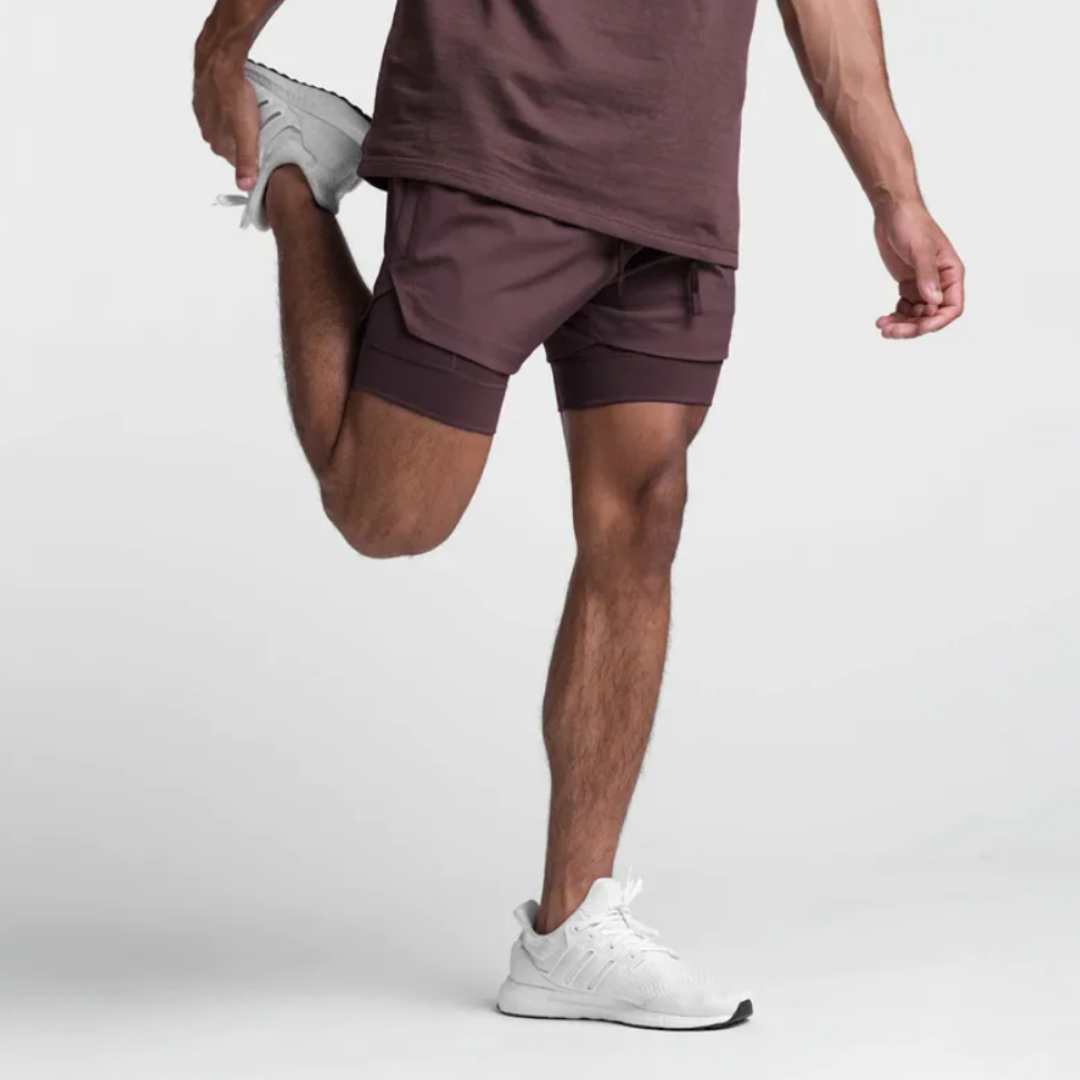 Empire Men's Shorts: Experience the perfect fusion of style and functionality with quick-dry technology, a double-layer design, and functional pockets. Quick dry efficiency for optimal comfort during workouts and outdoor activities. Double layer design for enhanced support and relaxed style. Functional pockets for on-the-go convenience. Elevate your activewear collection with Empire Men's Shorts – where practicality seamlessly meets fashion.