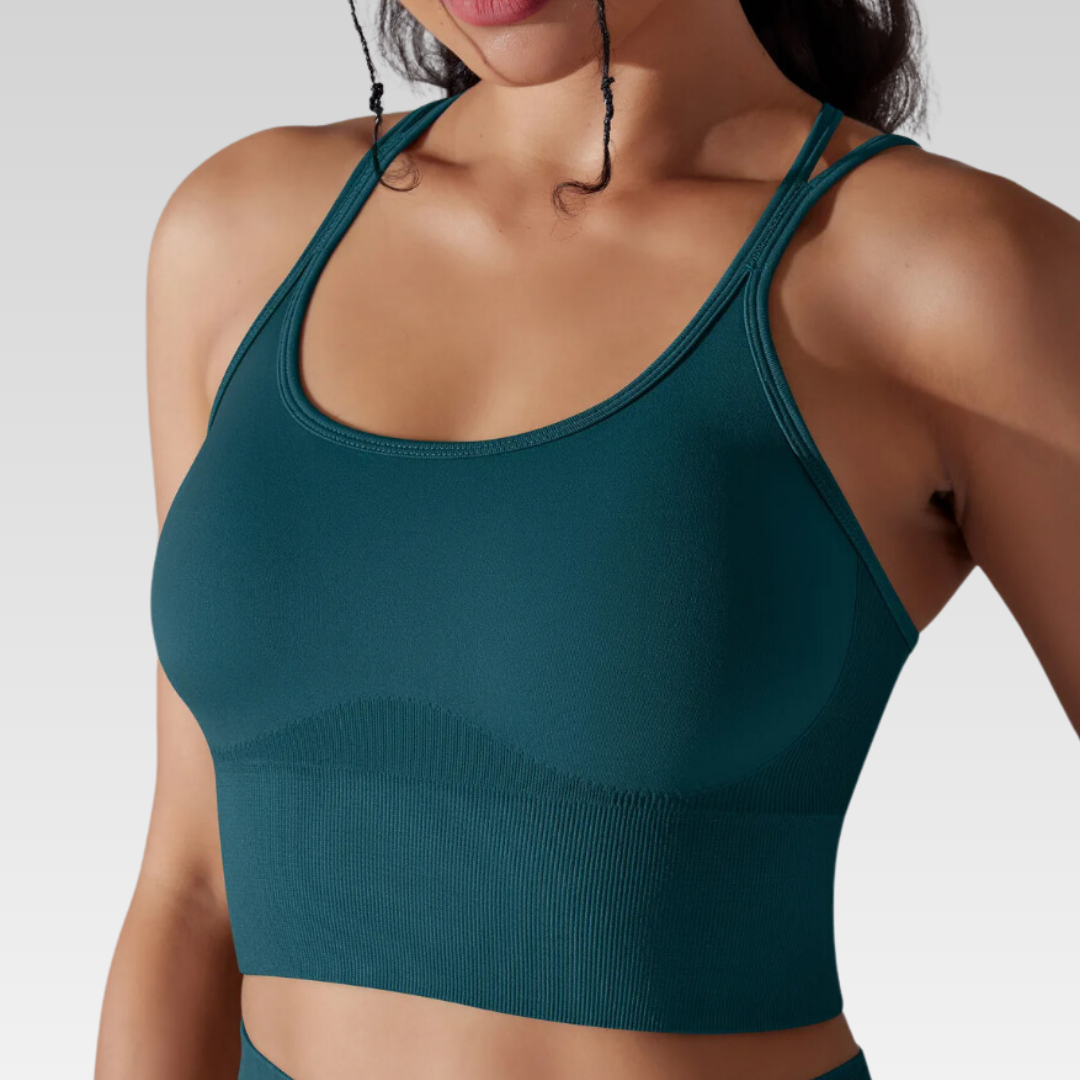 Georgia Cross Back Sports Bra: Medium support for versatile workouts. Crafted from a nylon/spandex blend for flexibility and style. Breathable design for cool workouts and quick-dry technology for on-the-go convenience. Elevate your workout confidence with the Georgia Sports Bra.