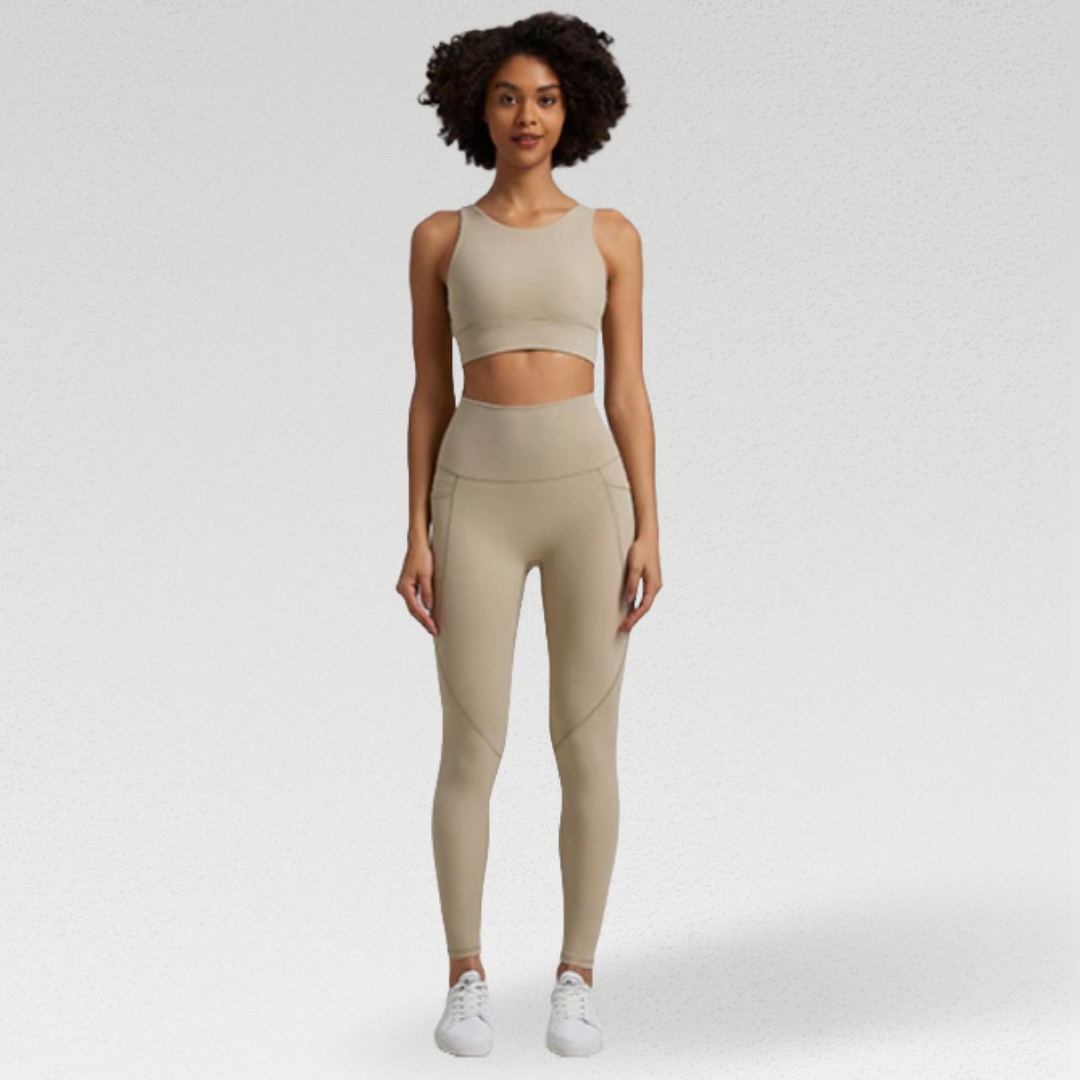 Women's two-piece gym set in breathable nylon/spandex blend. High-waisted leggings with seamless design for a flattering fit. Unique back design on sports bra adds style. Quick-drying material for comfort during workouts. Medium support and compression for unrestricted movement. Venus set - a must-have for any active woman's wardrobe.