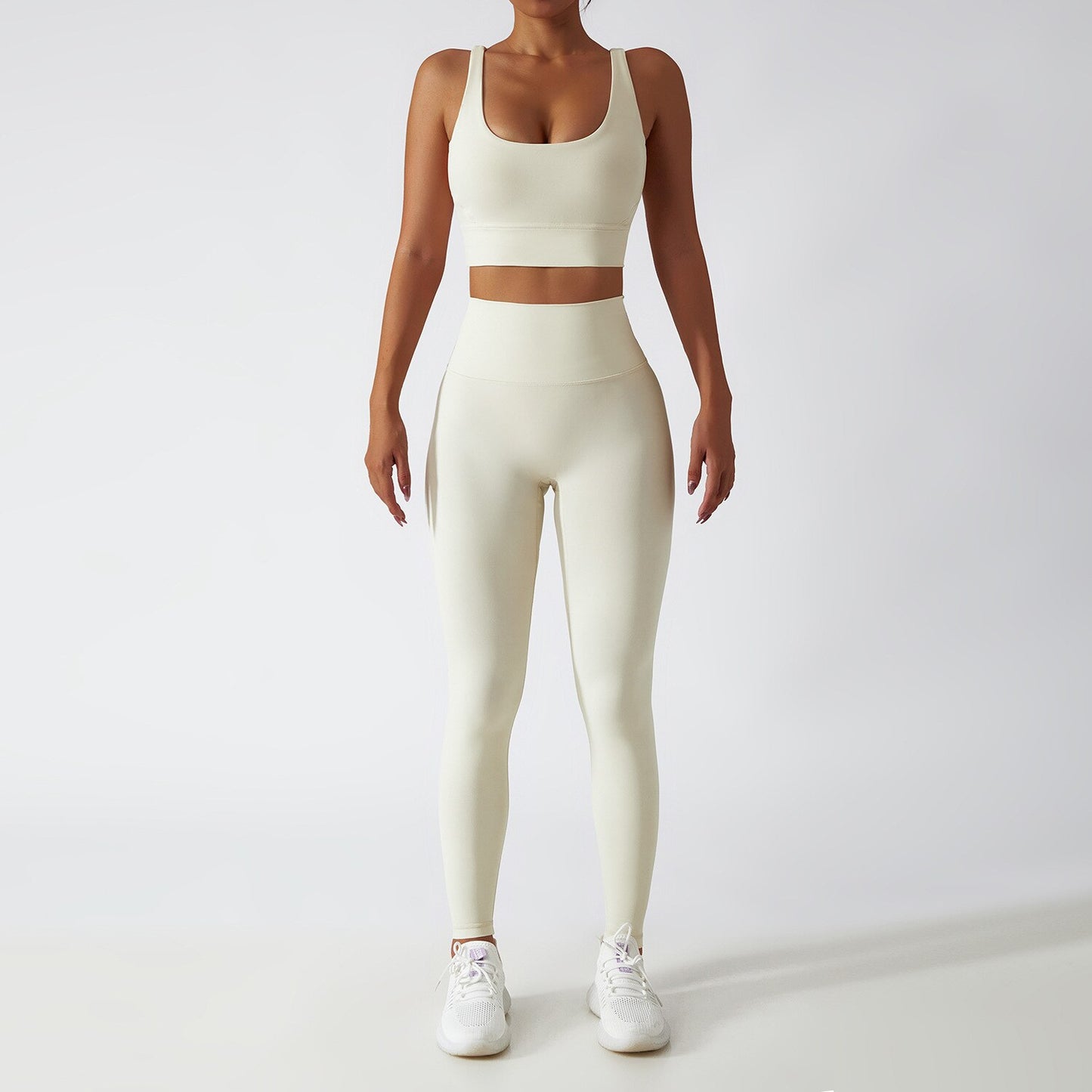 Women's Vitality Set in breathable nylon/spandex blend. Seamless high-waisted leggings for a flattering fit. Strappy sports bra with removable pads. Quick-drying material for comfort during workouts. Stylish and functional – a must-have for any active woman's wardrobe.