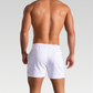 Cambridge Men's Shorts: Premium breathable cotton for cool comfort at home or on the go. Mid-length gym shorts with sweat-wicking material to keep you fresh during workouts or errands. Durable fabric ensures longevity. 3 pockets, drawstring waistband, and sweat-proof design make these shorts perfect for workouts or lounging.