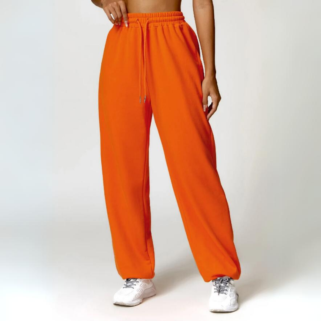 Talena Sweatpants - Premium cotton/poly blend for ultimate softness and durability. Elastic drawstring waistband for tailored comfort. Cuffed ankles for stylish versatility. Elevate your loungewear experience with the cozy and chic Talena Sweatpants.