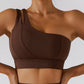 Demeter Tennis Skirt Set - Elevate your sports style with this two-piece activewear set. The high waisted tennis skirt with privacy shorts and one-shoulder sports bra provide maximum comfort, breathability, and durability for tennis, golf, running, and more. Made from a high-quality nylon/spandex blend.