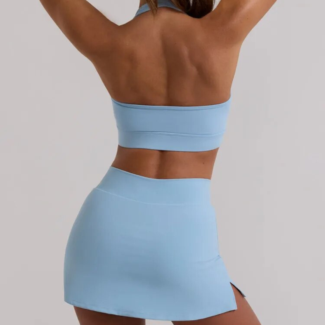 Lucinda Halter and Skort Set: Elevate Your Activewear with Fashion-Forward Design and High-Performance Functionality - Breathable Comfort, Innovative Skort Design with Cross-Over Waist, and Halter Neck Sports Bra for Support and Style. Conquer Your Fitness Goals in the Perfect Fusion of Fashion and Function.