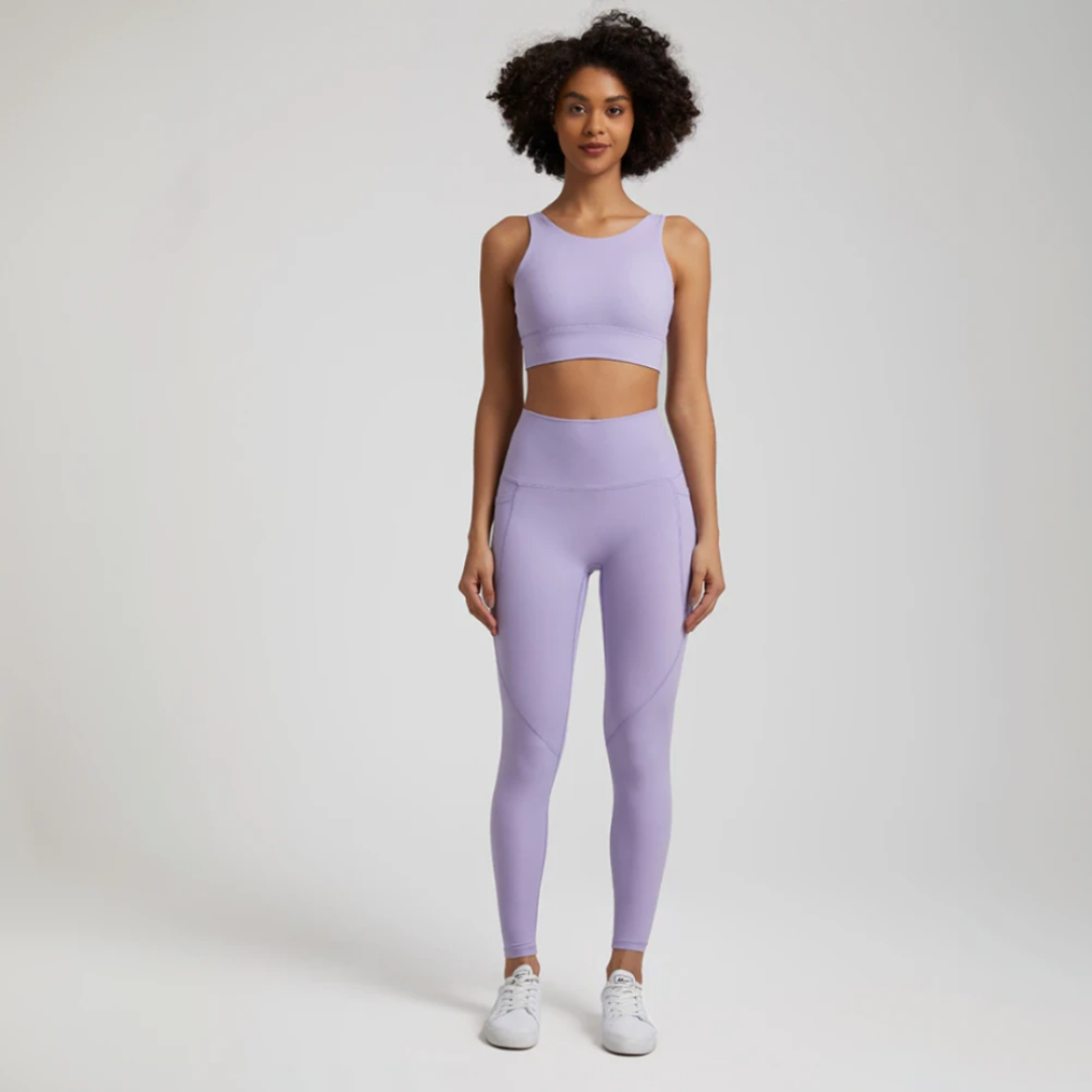 Women's two-piece gym set in breathable nylon/spandex blend. High-waisted leggings with seamless design for a flattering fit. Unique back design on sports bra adds style. Quick-drying material for comfort during workouts. Medium support and compression for unrestricted movement. Venus set - a must-have for any active woman's wardrobe.