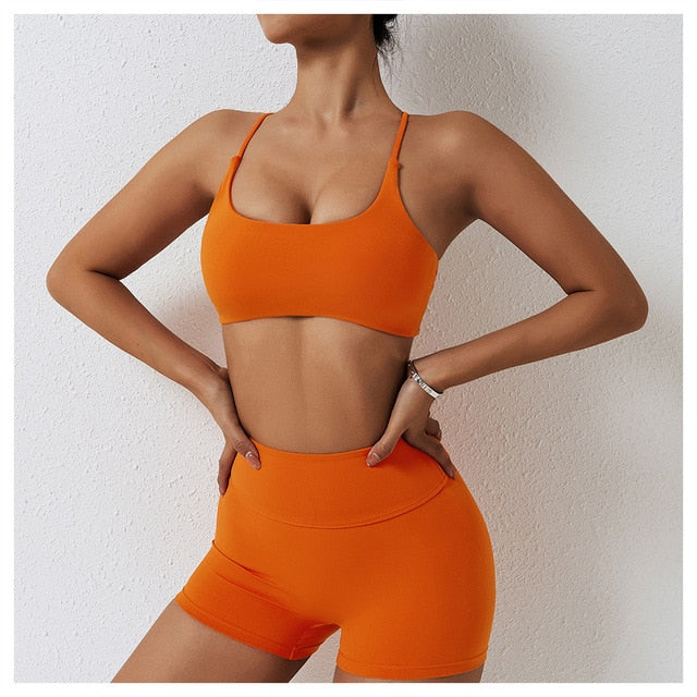 Cali Set - Elevate your workout with high-waisted shorts and cross back sports bra. Quick-dry, breathable, and stylish for a comfortable and fashionable gym session.