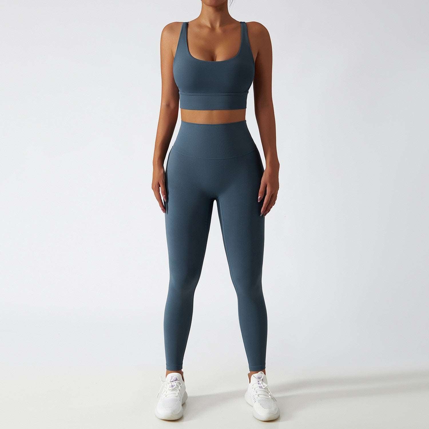 Women's Vitality Set in breathable nylon/spandex blend. Seamless high-waisted leggings for a flattering fit. Strappy sports bra with removable pads. Quick-drying material for comfort during workouts. Stylish and functional – a must-have for any active woman's wardrobe.