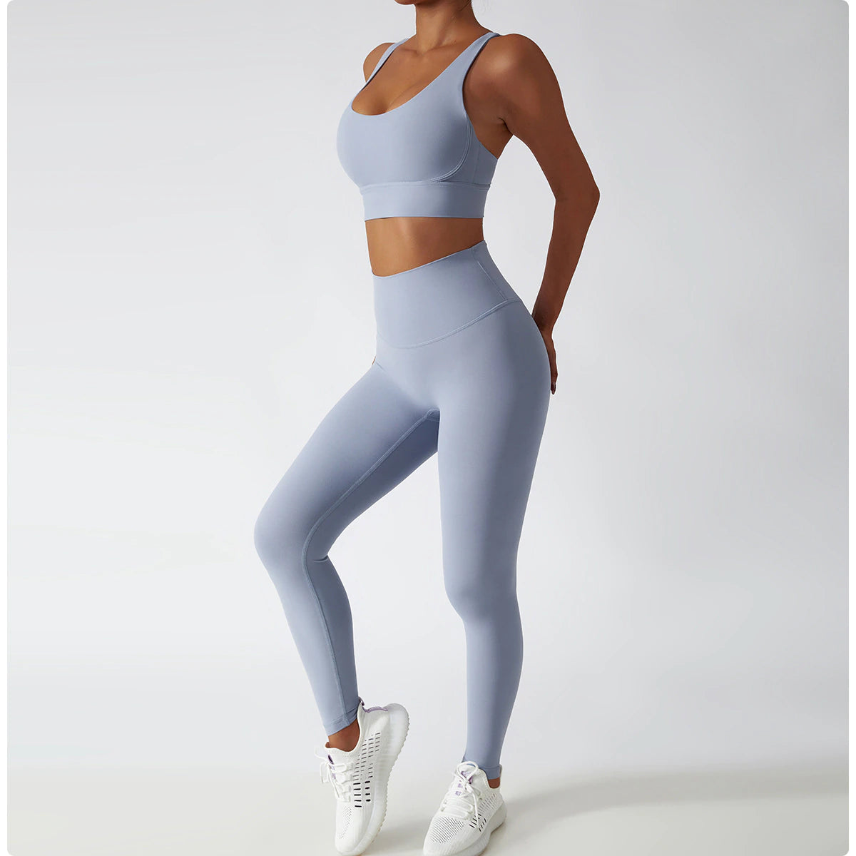 Women's Vitality Set in breathable nylon/spandex blend. Seamless high-waisted leggings for a flattering fit. Strappy sports bra with removable pads. Quick-drying material for comfort during workouts. Stylish and functional – a must-have for any active woman's wardrobe.