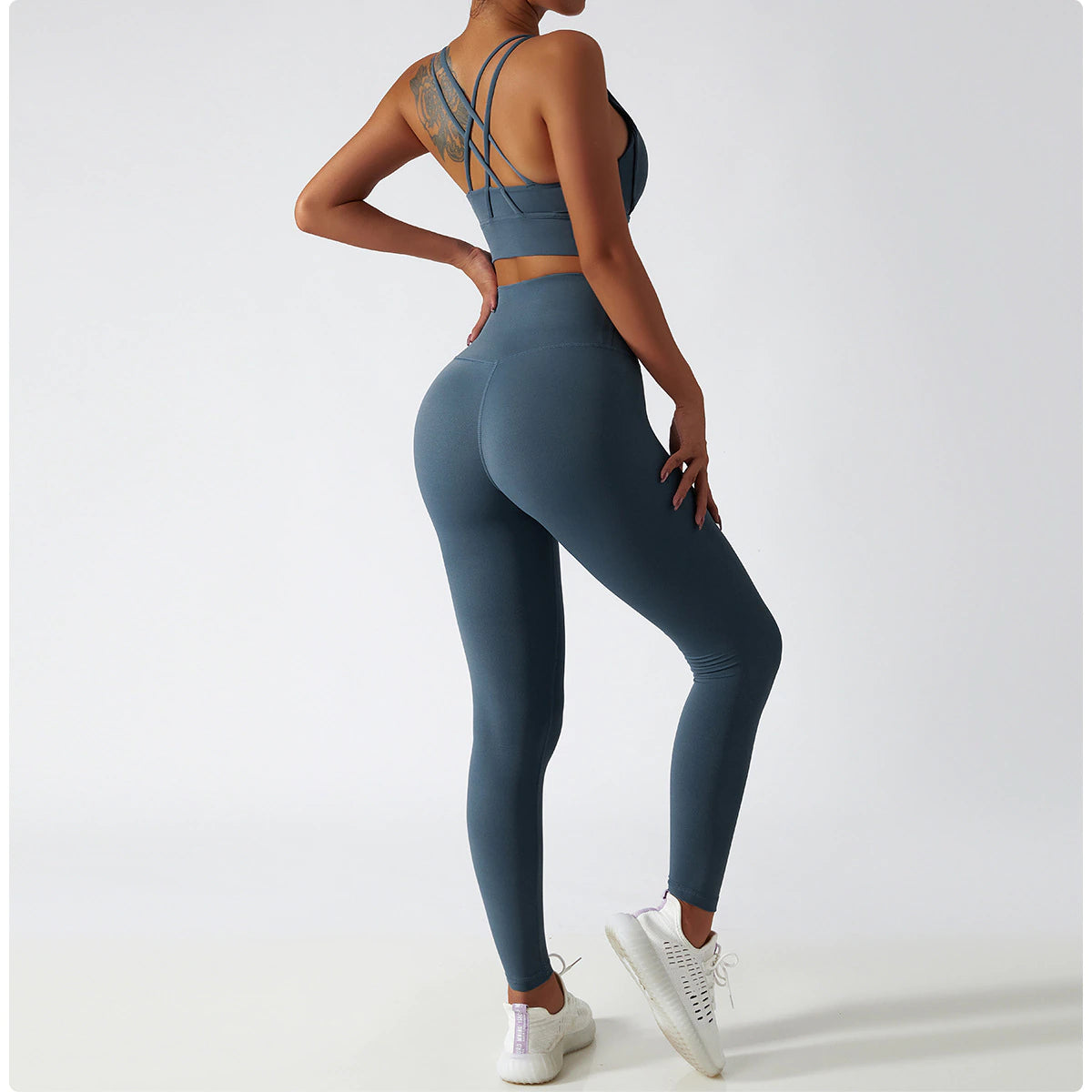 Women's Vitality Set in breathable nylon/spandex blend. Seamless high-waisted leggings for a flattering fit. Strappy sports bra with removable pads. Quick-drying material for comfort during workouts. Stylish and functional – a must-have for any active woman's wardrobe.